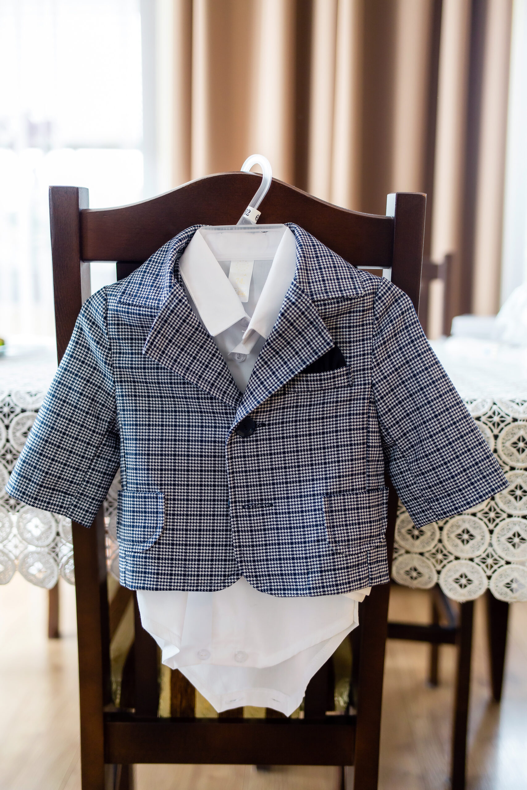 Fotograf na chrzest Łódź ubranko dla dziecka